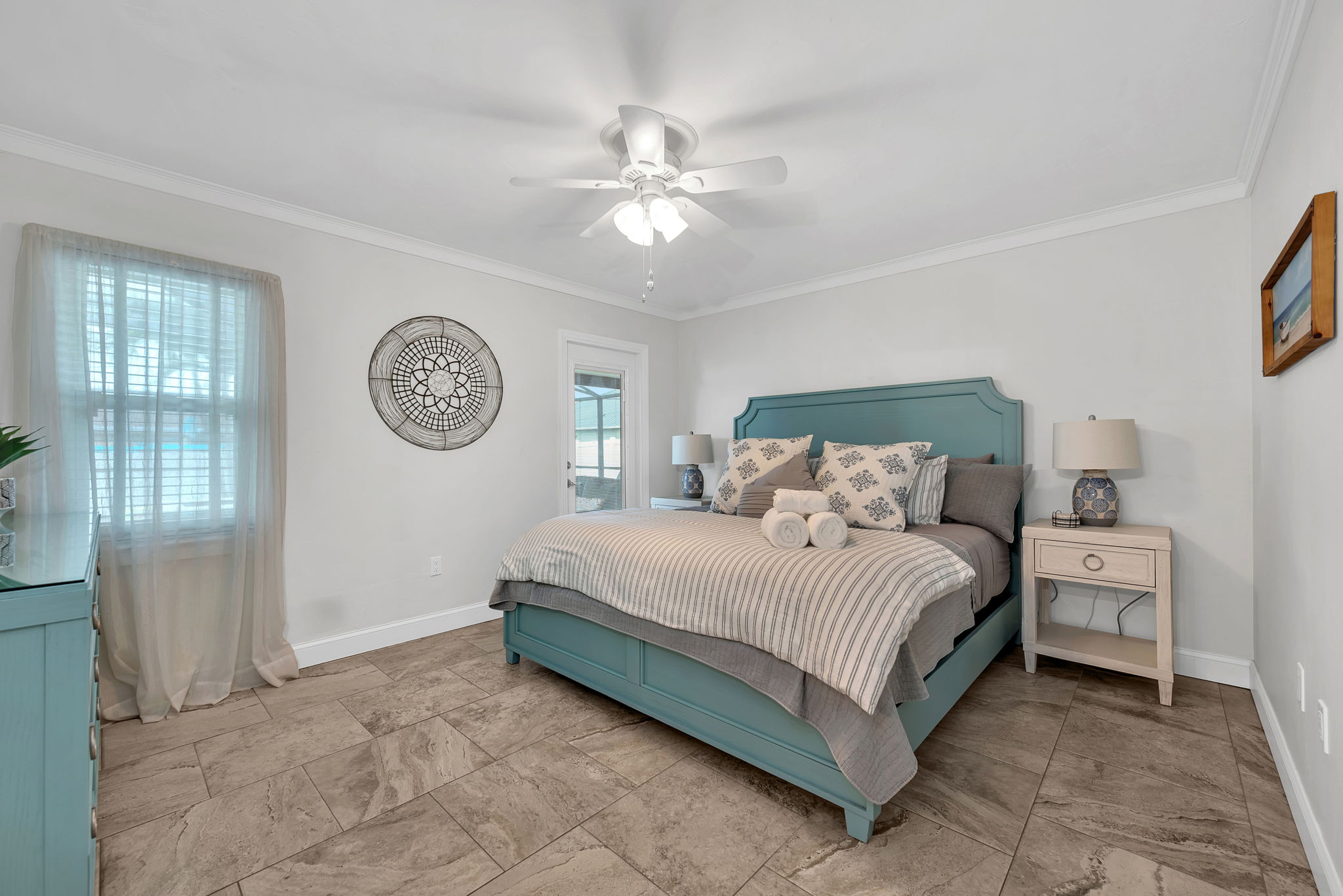 Primary bedroom with coastal decor