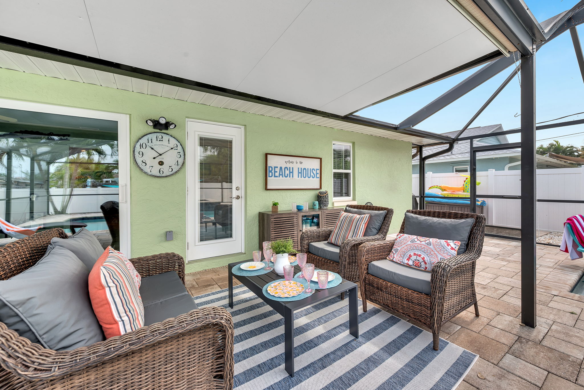 Outdoor sitting area beside the pool